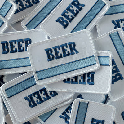 Embroidered BEER patch with vintage '70s '80s inspired generic blue stripe embroidery design