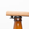 Quercus Alba Reclaimed Wood Bottle Opener on bottle cap ready to open