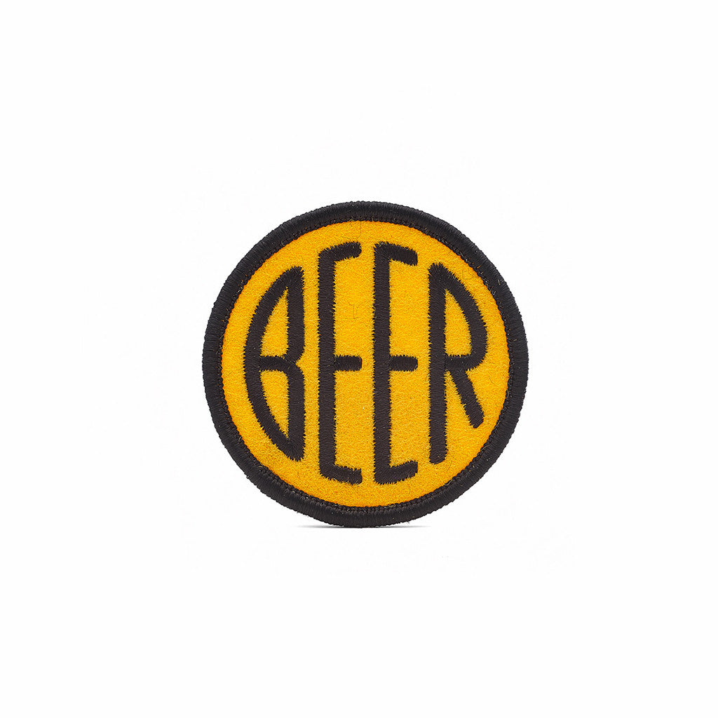 Embroidered BEER patch with black embroidery thread on yellow felt